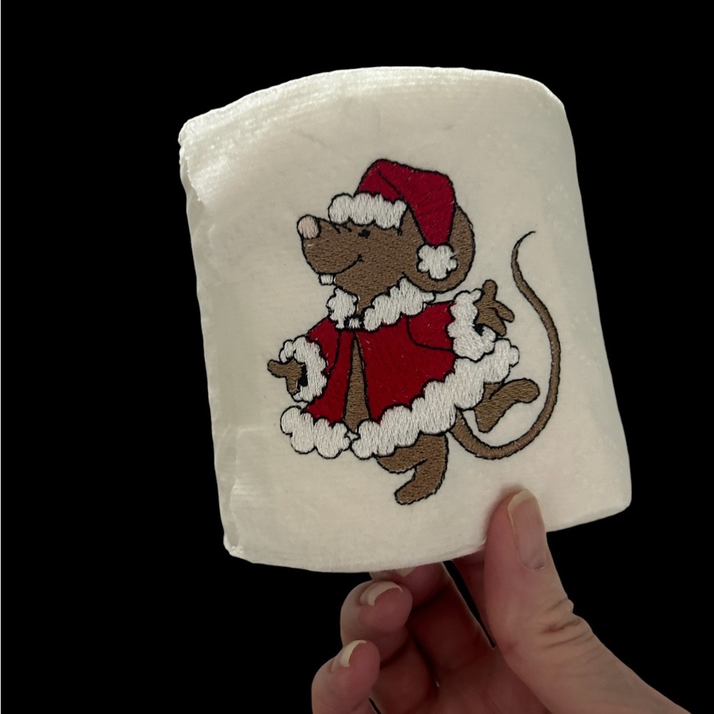 Mouse embroidery on toilet tissue roll.